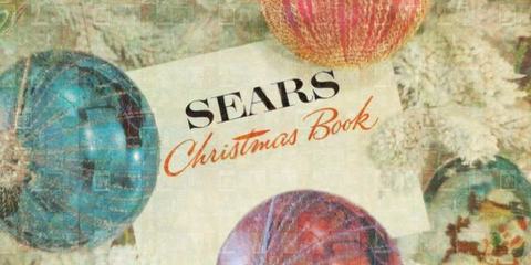 Cover of a Sears Christmas Book catalogue, the words Sears Christmas Book on a torn paper label over a photograph of glass tree ornaments